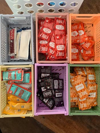 taco bell hot sauce packets organized in baskets
