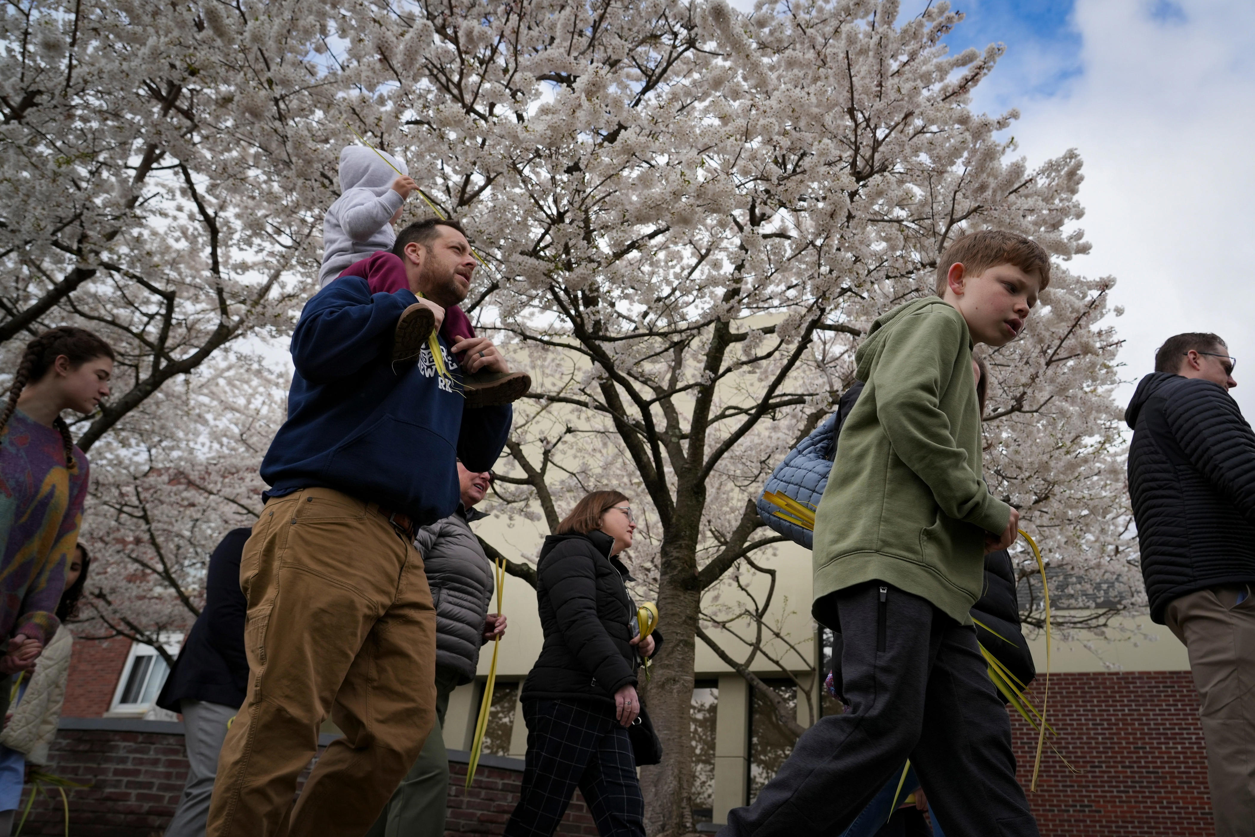 Palm Sunday community walk calls for 'politics of compassion and care'