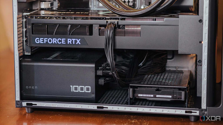 Lower half of a gaming PC case with a Geforce RTX graphics card and 1000W PSU