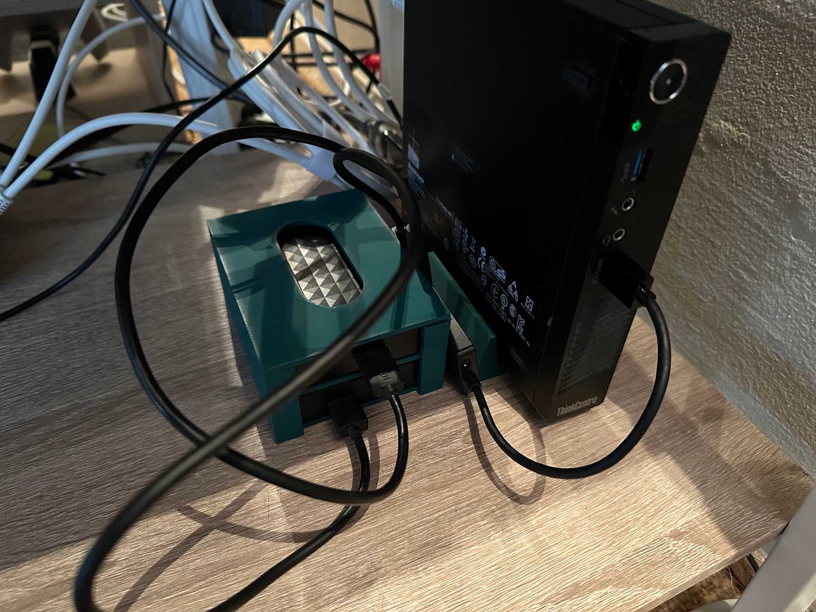A mini-PC Plex server with 3D printer stand and HDD caddy.