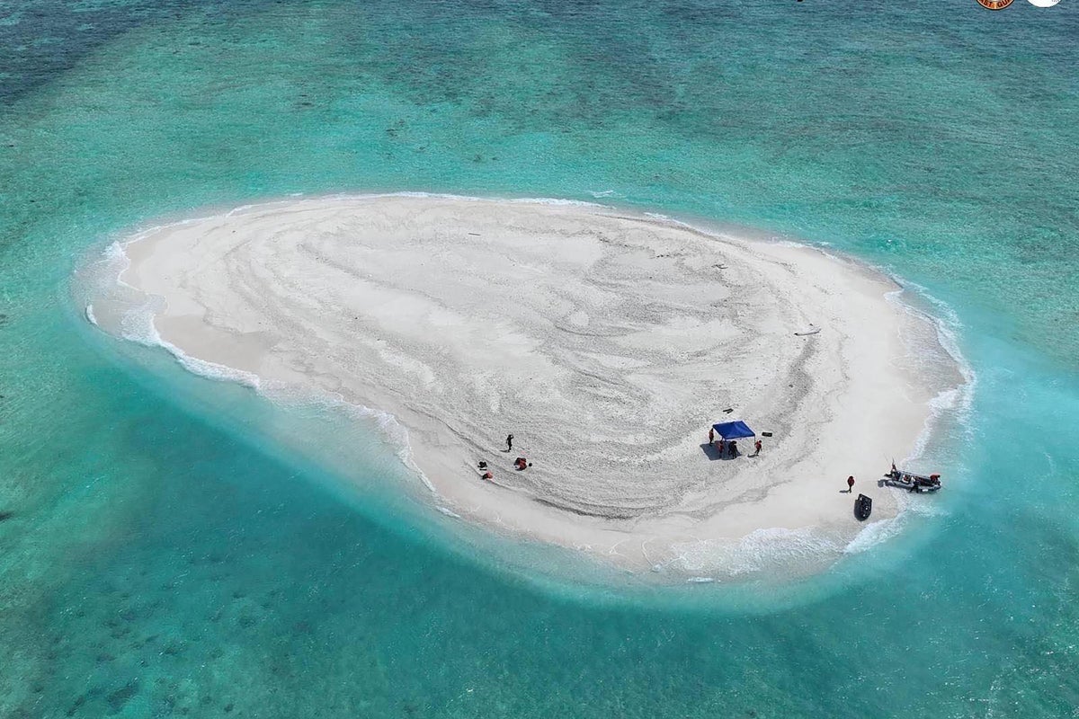 China seizes control of disputed reef and plants national flag near ...