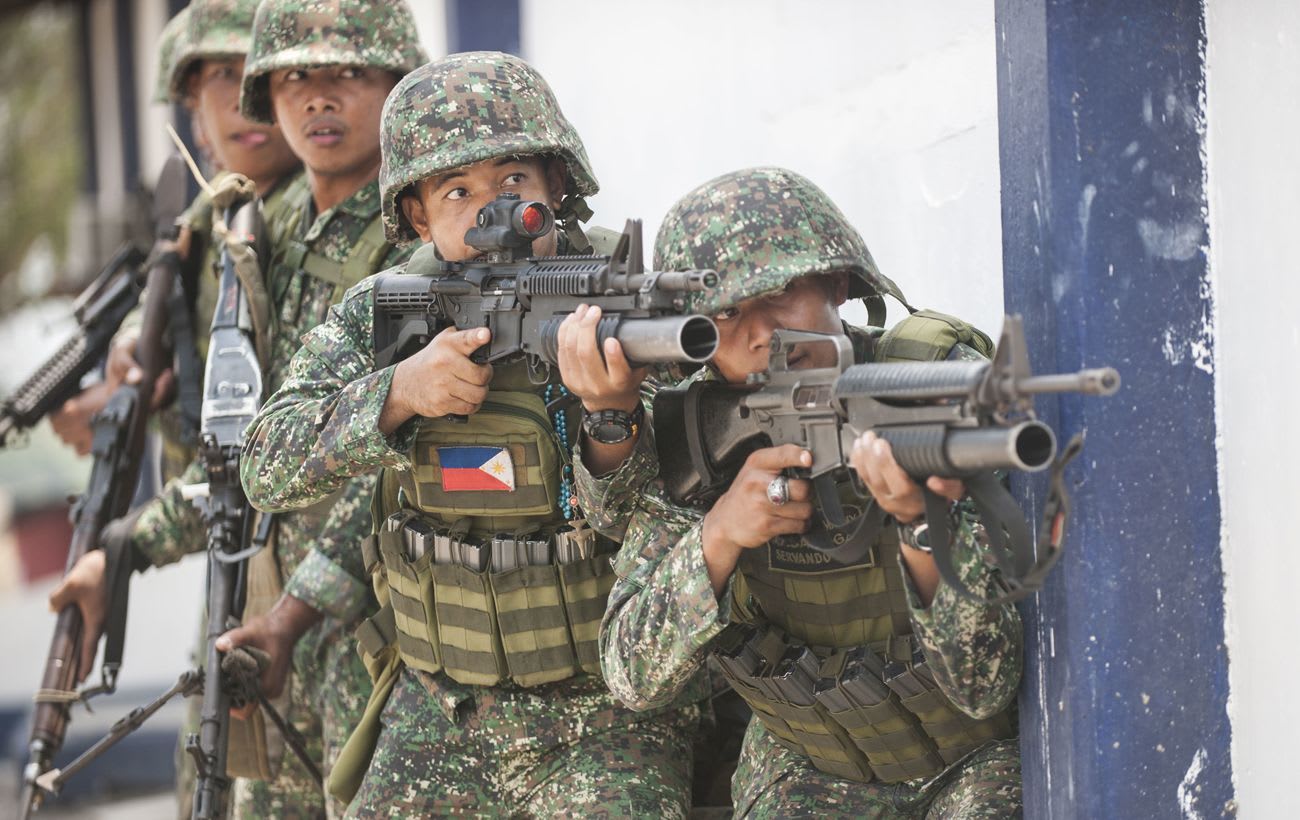 Philippines responds to China by landing and raising flag on disputed ...