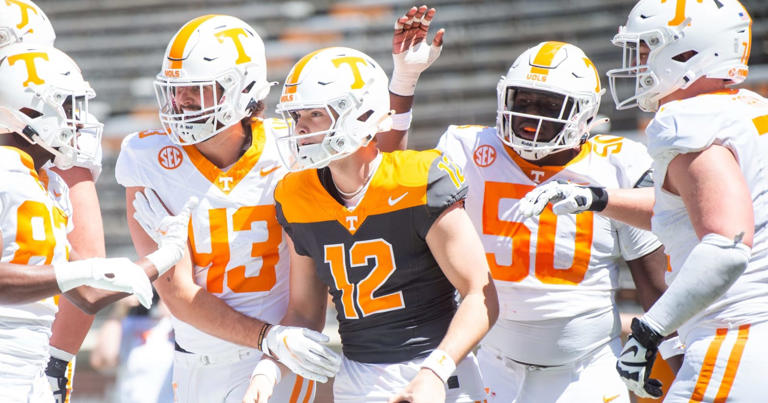 (Brianna Paciorka/News Sentinel / USA TODAY NETWORK) Teammates celebrate a touchdown by Tennessee quarterback Jake Merklinger (12) during Tennessee's Orange & White spring football game at Neyland Stadium on Saturday, April 13, 2024.