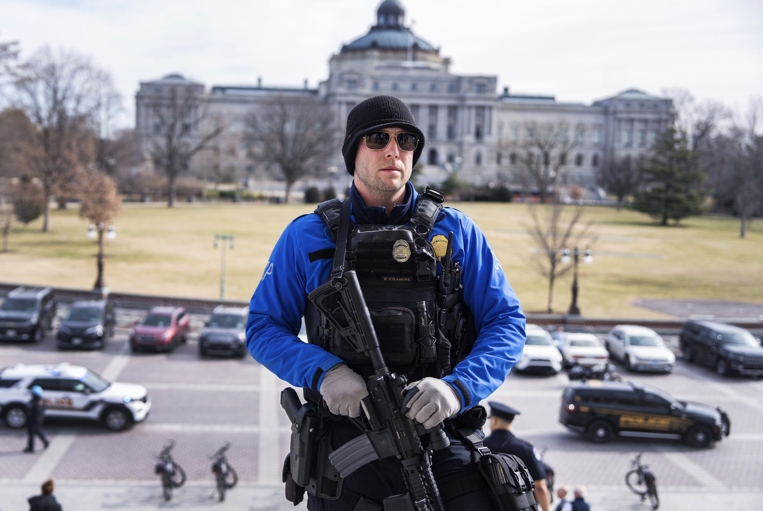 An armed Capitol Police officer is seen on the House steps the U.S. Capitol after the last vote of the week on Friday, February 7, 2025. Tom Williams/CQ Roll Call via AP Images