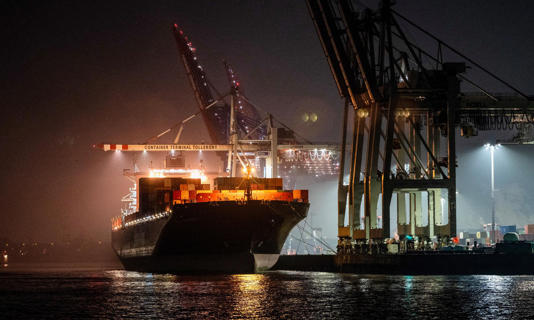 A container ship is moored at a terminal of the port in Hamburg. In 2021 police announced Europe’s biggest ever seizure of cocaine at the port: 16 tonnes stashed in 1,700 wall-putty tins shipped from Paraguay. Photograph: Ina Fassbender/AFP/Getty Images