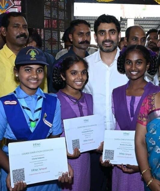 Pravalika and a few of her classmates with Nara Lokesh