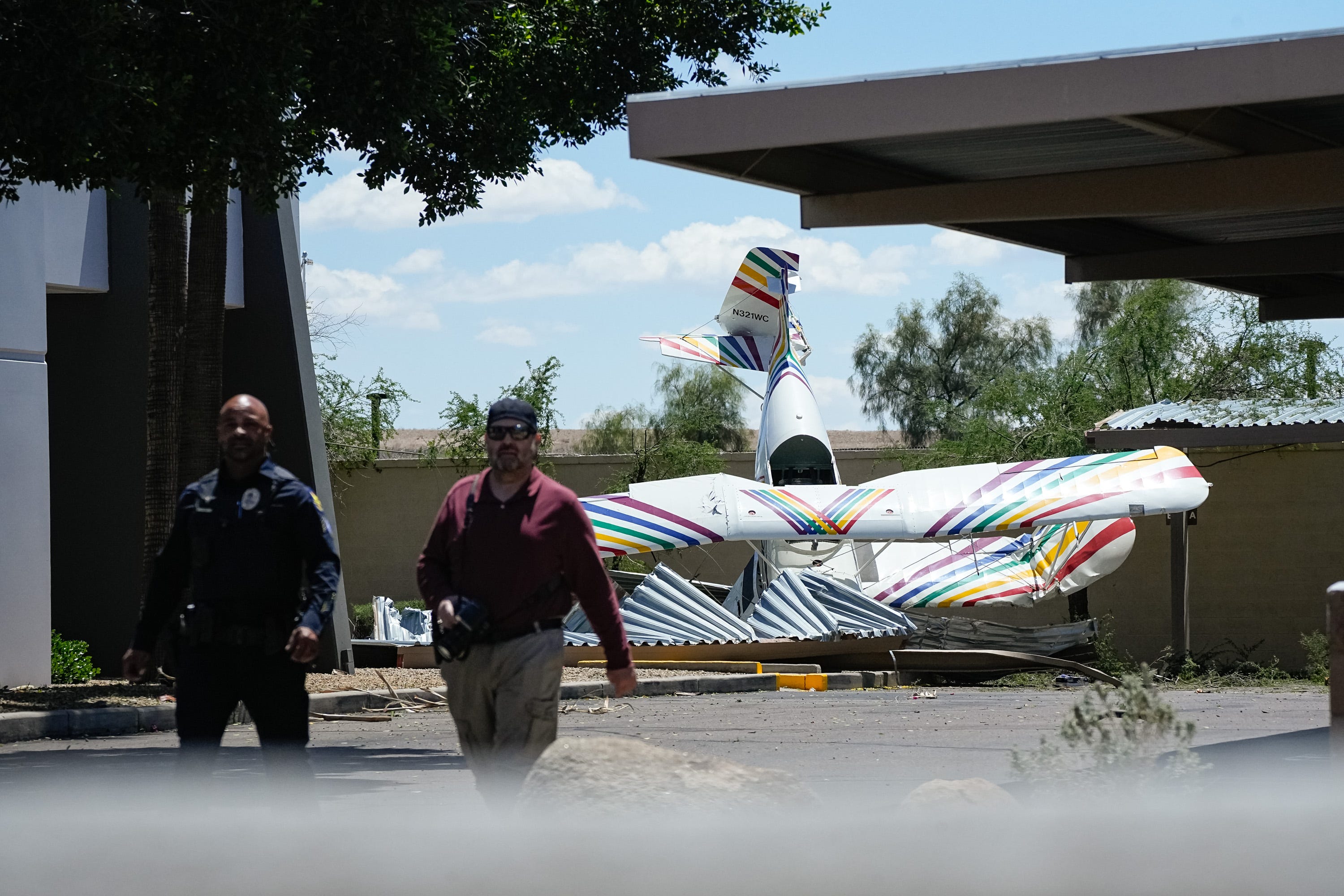 The scene of a plane crash which occurred south of Deer Valley Airport at the parking lot of an office building on April 19, 2025, in Phoenix, Ariz.