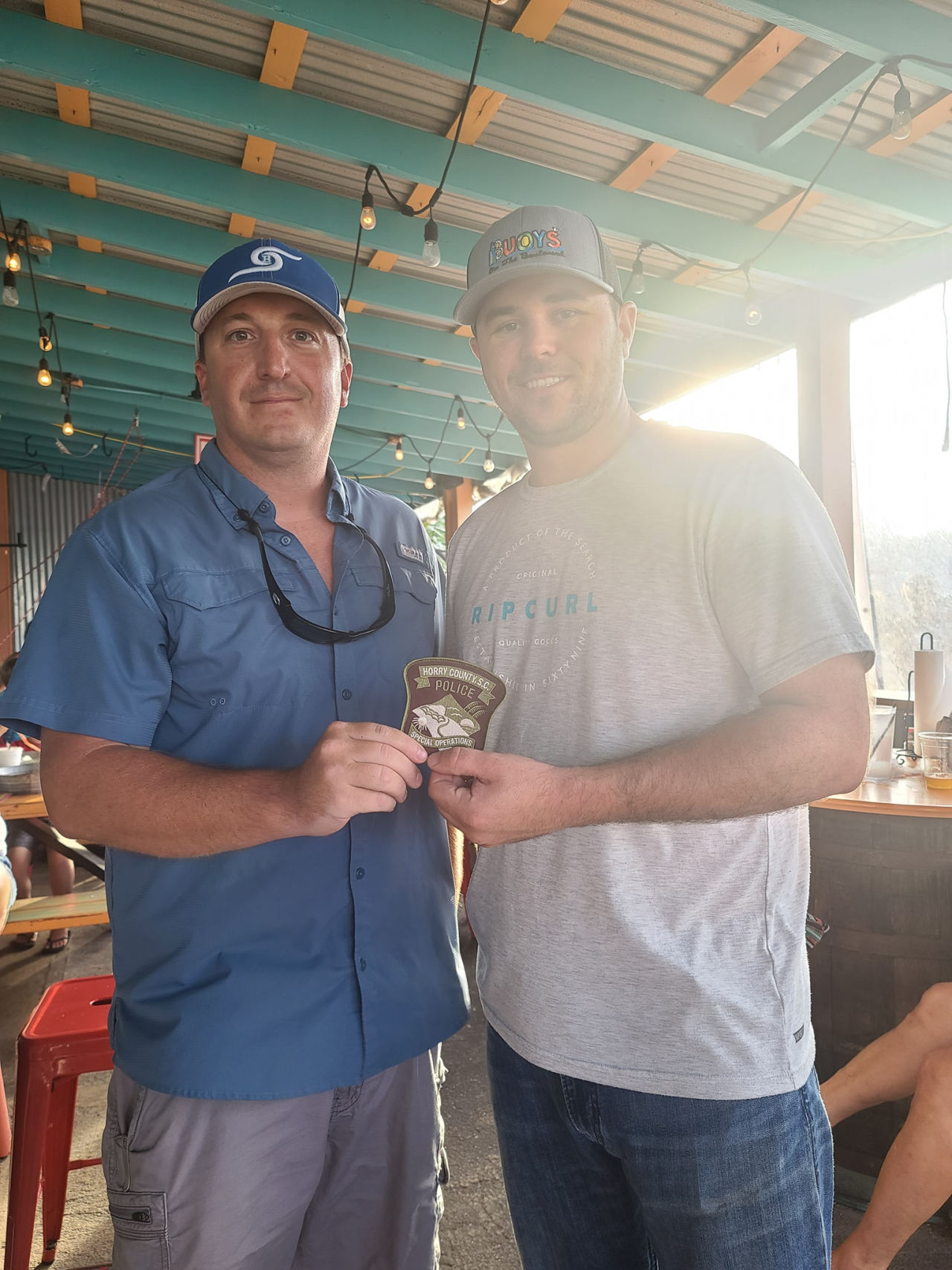 A photo showing Brandon Strickland, left, giving Weldon Boyd an honorary Horry County Police Department Special Operations patch, posted on Boyd’s Facebook on Aug. 7, 2020.