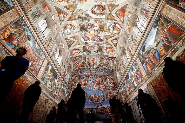 Visitors admire the Sistine Chapel inside the Vatican Museums on the occasion of the museum's reopening, 3 May, 2021 AP Photo