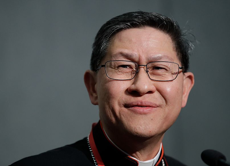 Cardinal Luis Tagle smiles as he listens to reporters' questions during a press conference on the Synod at the Vatican, 23 October, 2018 AP Photo