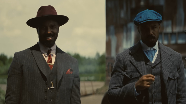 Michael B Jordan as Smoke and Stack standing outside of the juke in Sinners