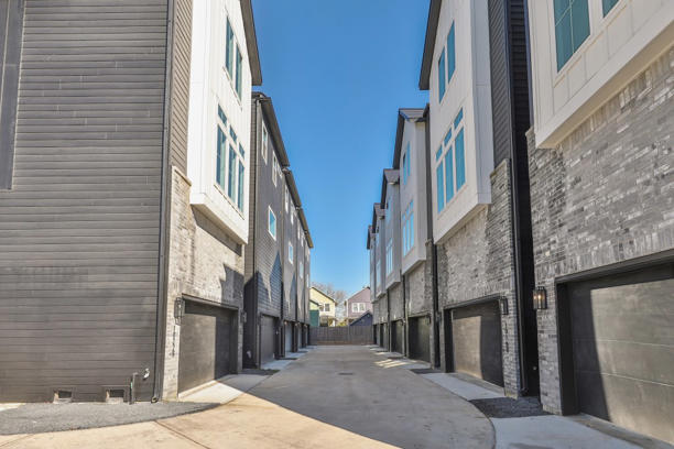 The homes are equipped with Tesla’s solar roof shingles, Powerwall battery storage and EV chargers. K2 Imagery