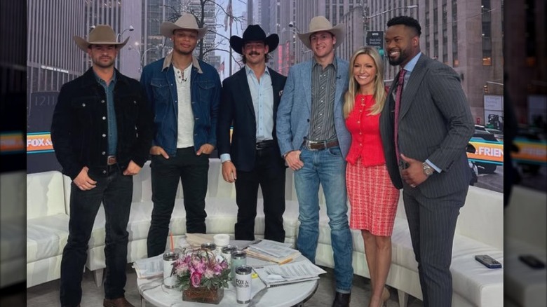 Ainsley Earhardt and Lawrence Jones pose with the cast of "Farmer Wants A Wife" (2025)