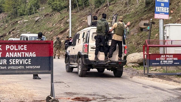 Security personnel rush to spot after terrorists attacked a group of tourists at Pahalgam, in Anantnag district, Jammu & Kashmir, Tuesday, April 22, 2025.