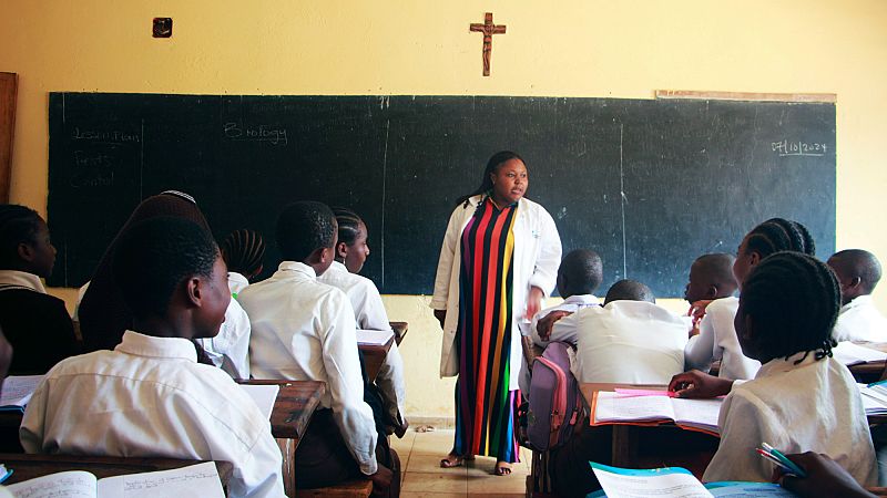 Students listen to the teacher in the Holy Infant high school, in Yaounde, Cameron, Monday, Oct. 7, 2024