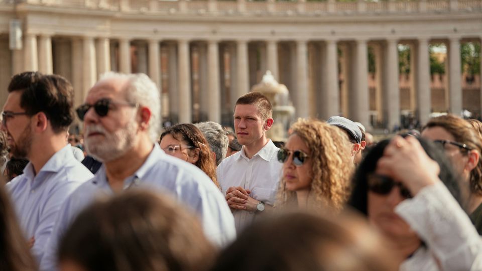 People gather in St. Peter's Square as they await the arrival of the body of Pope Francis. - Andreea Alexandru/AP