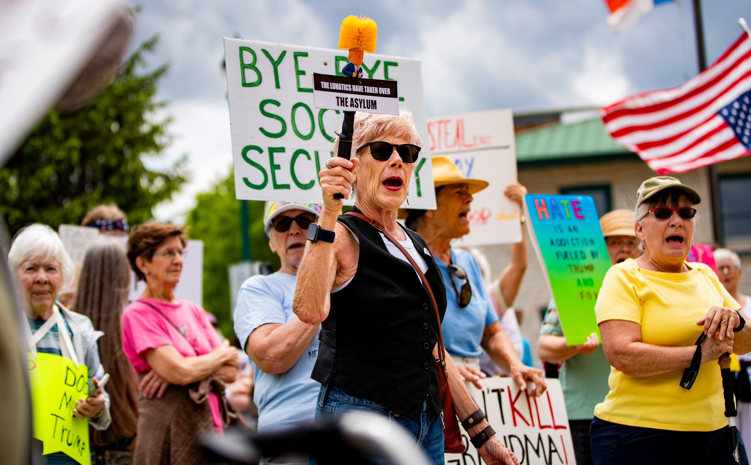Protesters gather on the steps of the Historic Henderson County Courthouse in downtown Hendersonville, May 1, 2025, to protest the Trump administration.