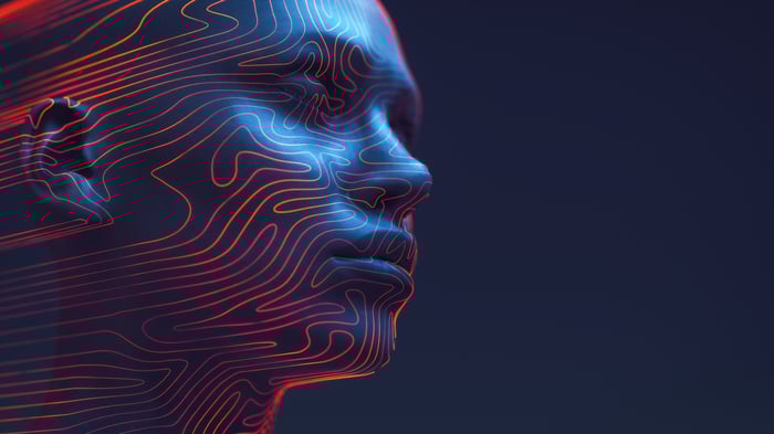 A silhouette of a face with digital lines on it.