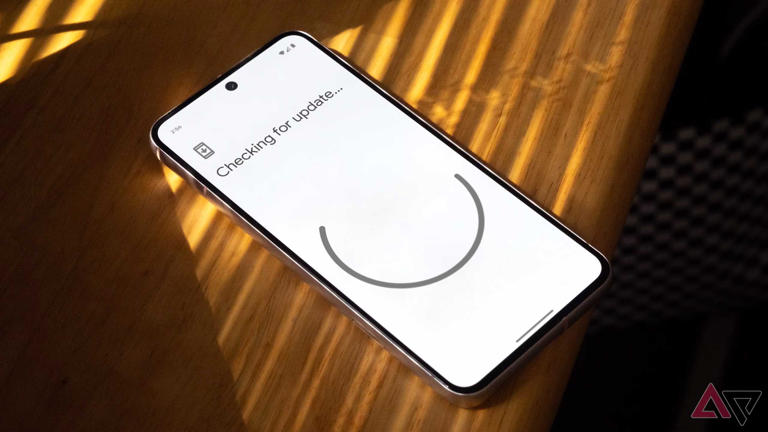 A Google Pixel on the "Checking for update" screen that appears before installing a new Android version
