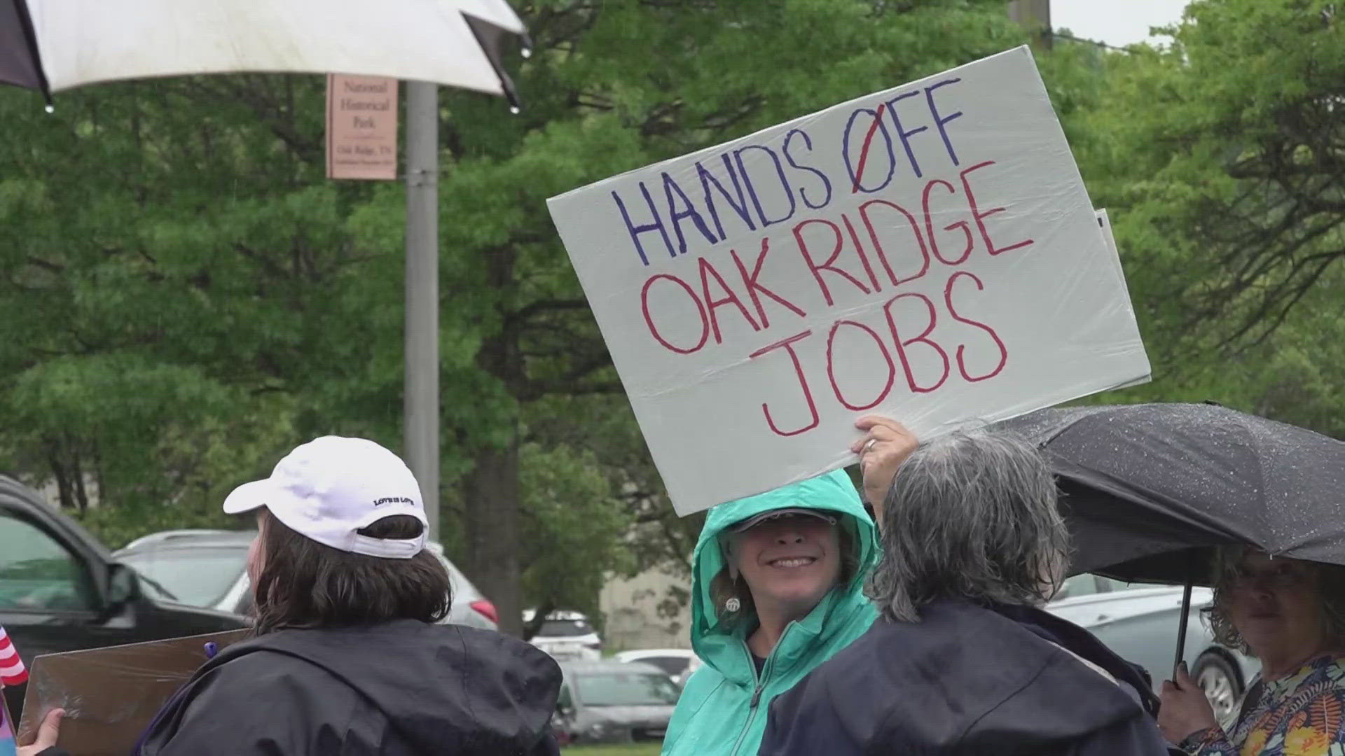 Dozens gather on rainy day to participate in 'Hands Off' protest in Oak ...