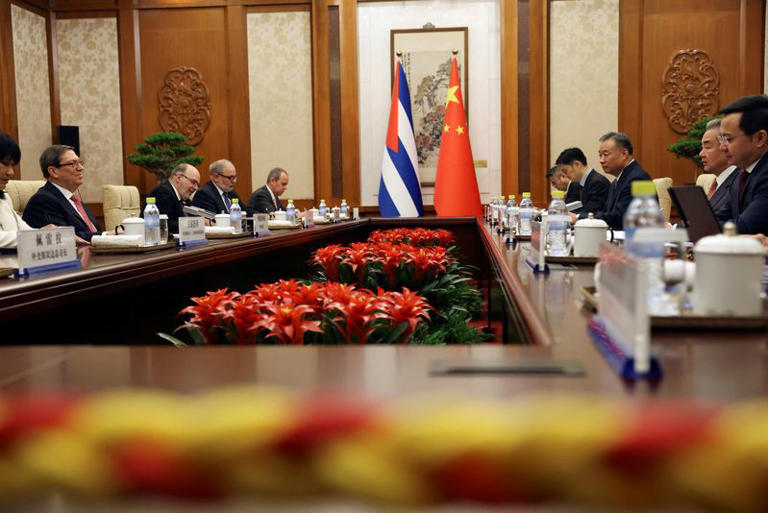 Chinese Foreign Minister Wang Yi and Cuban Foreign Minister Bruno Rodriguez Parrilla attend a meeting at the Diaoyutai State Guesthouse in Beijing, China May 12, 2025. REUTERS/Florence Lo/Pool