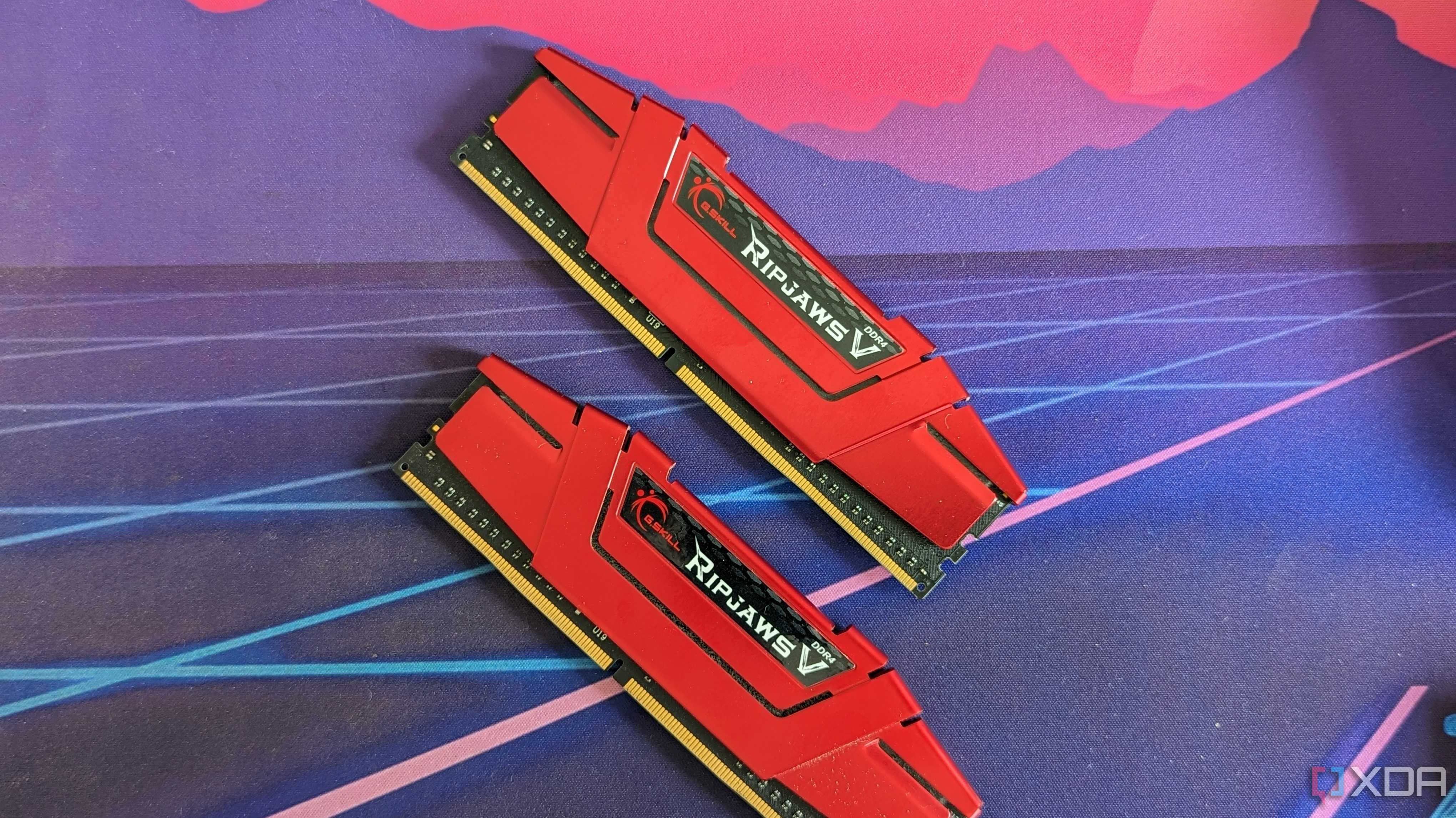 Two red sticks of G.Skill Ripjaws DDR4 RAM on a desk mat