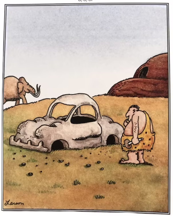 A caveman invents a car with no wheels in The Far Side.