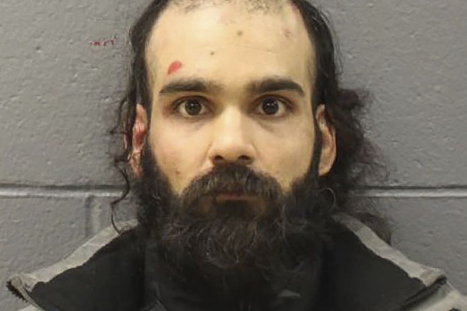 Man Who Tried to Stab Flight Attendant with Broken Spoon After