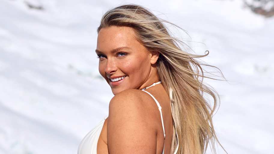 Camille Kostek Is a Vision in White While Walking the Red Carpet for SI