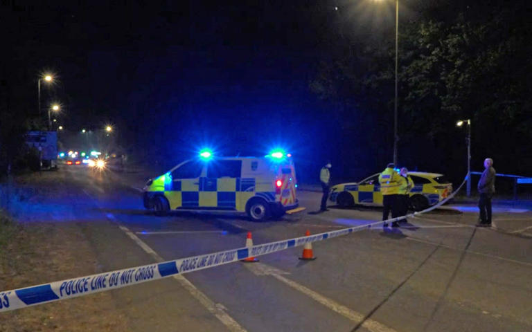 Police cordon off road approaches to the fire at the former RAF Bicester - Jamie Lashmar/PA