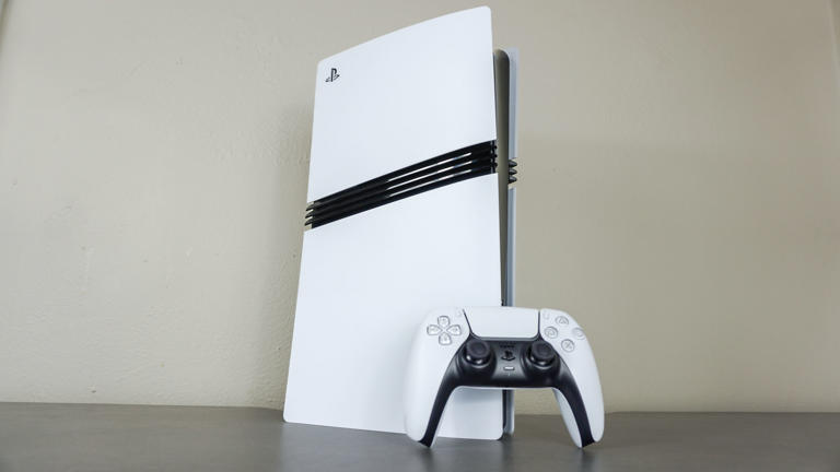 The PS5 Pro with a DualSense controller on a desk