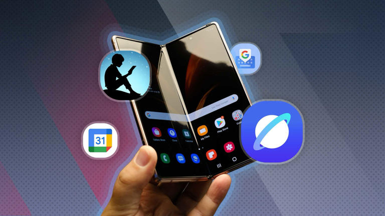 A hand holding a foldable phone with some app logos around it