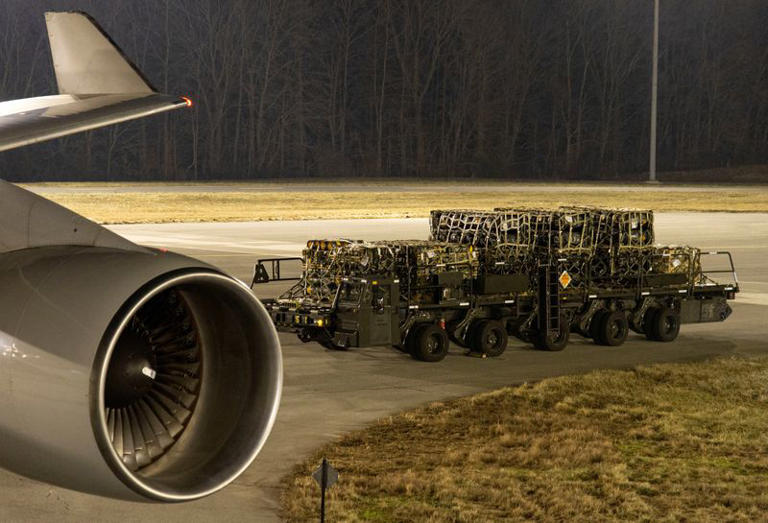 FILE PHOTO: A 436th Aerial Port Squadron ramp services Airman stages a cargo loader with palletised ammunition, weapons and other equipment bound for Ukraine during a foreign military sales mission at Dover Air Force Base, Delaware, U.S., January 24, 2022. U.S. Air Force photo/Roland Balik/Handout via REUTERS/File Photo