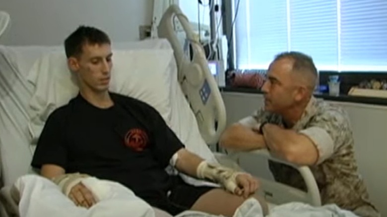 Joey Jones speaks to a member of the military during his time in hospital.