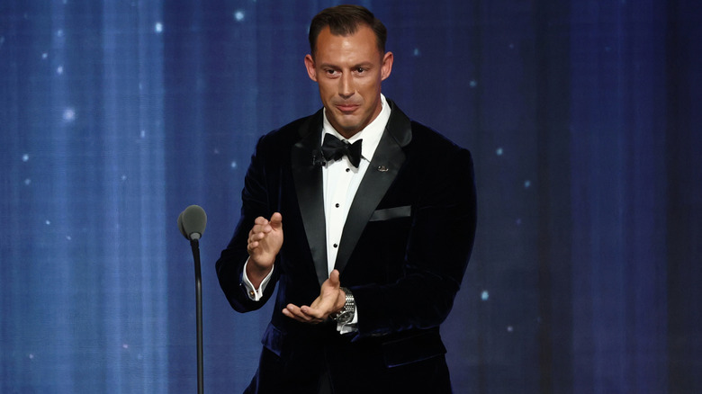 Johnny Joey Jones claps on stage at the Patriot Awards.