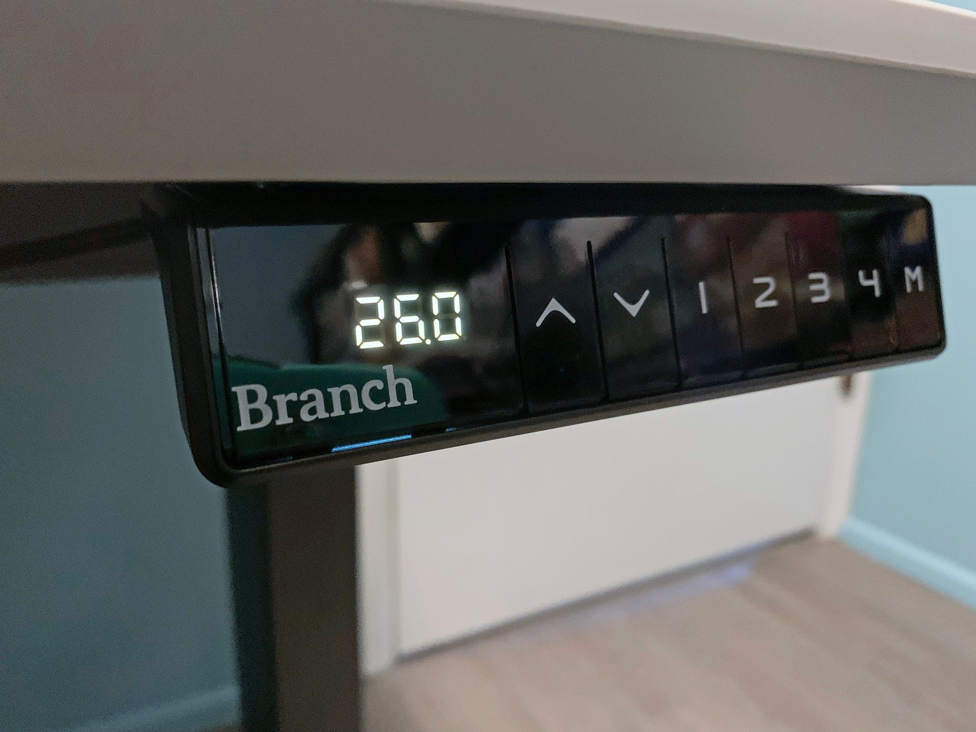 The Branch Standing Desk control panel showing four preset buttons and a height display of 26 inches.