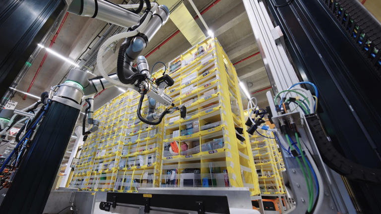 Amazon's new Vulcan robot frees up workers to focus their efforts on objects stored in mid-height bins. Amazon