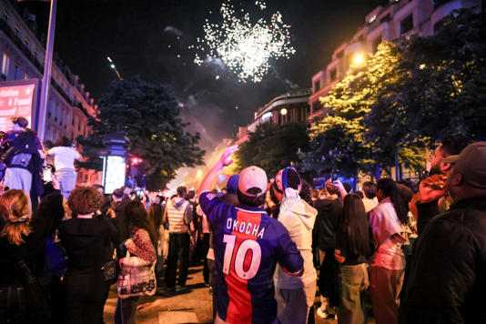 Paris Saint-Germain fans celebrate after the Champions League semifinal, second leg soccer match between PSG and Arsenal on the Champs-Elysees avenue in Paris, Wednesday, May 7, 2025. (AP Photo/Thomas Padilla) (Copyright 2025 The Associated Press. All rights reserved.)
