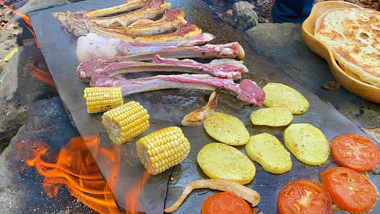 Wild lamb ribs cooked on hot rocks