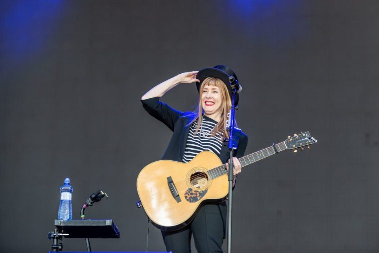 Suzanne Vega in a vibrant moment, capturing the essence of live performance.