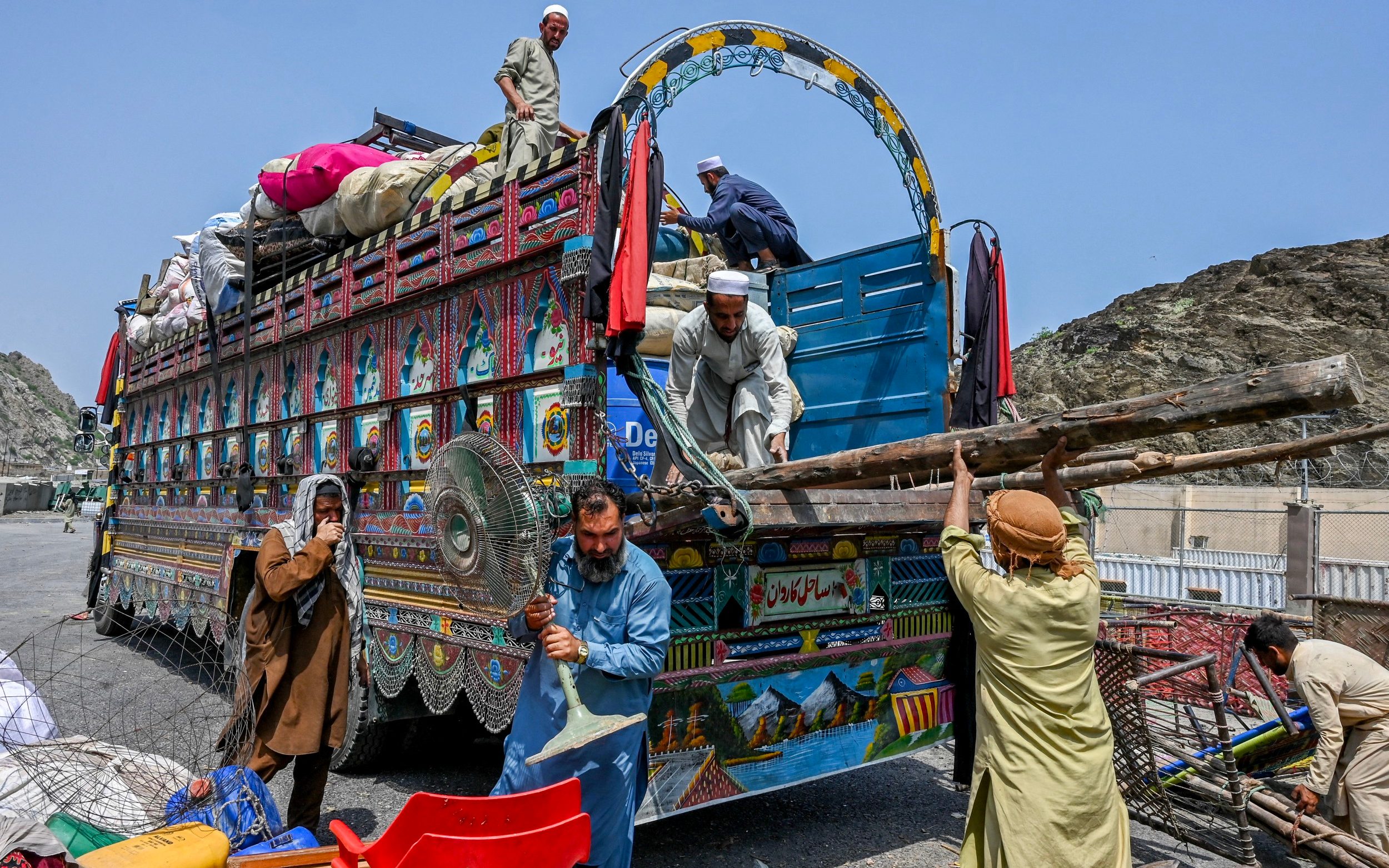 Afghan refugees at the Pakistan-Afghanistan border in Torkham prepare for deportation to their home country - ABDUL MAJEED/AFP/Getty Images