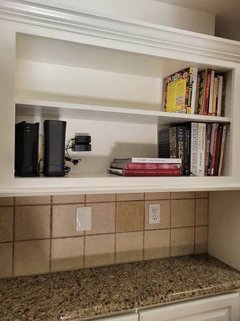 reviewer's kitchen shelves with cords and routers out