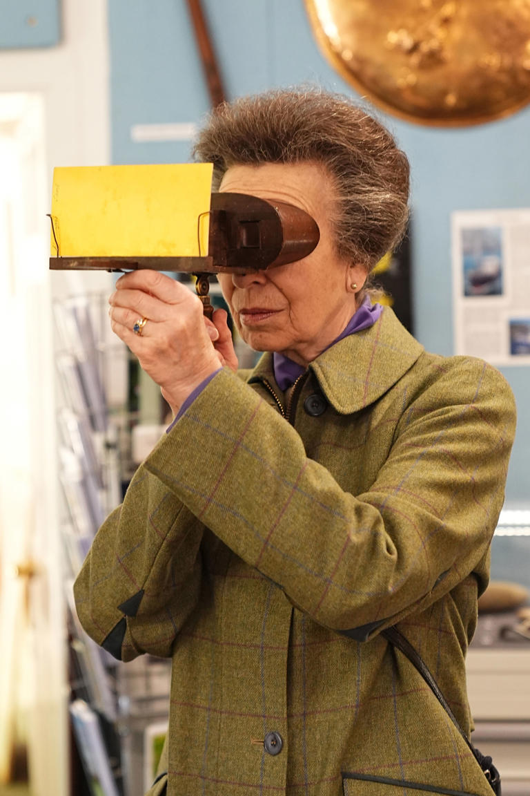 The Princess Royal looking at photos using a stereoscopic viewer during a visit to the Sark Society (Aaron Chown/PA) (PA Wire)