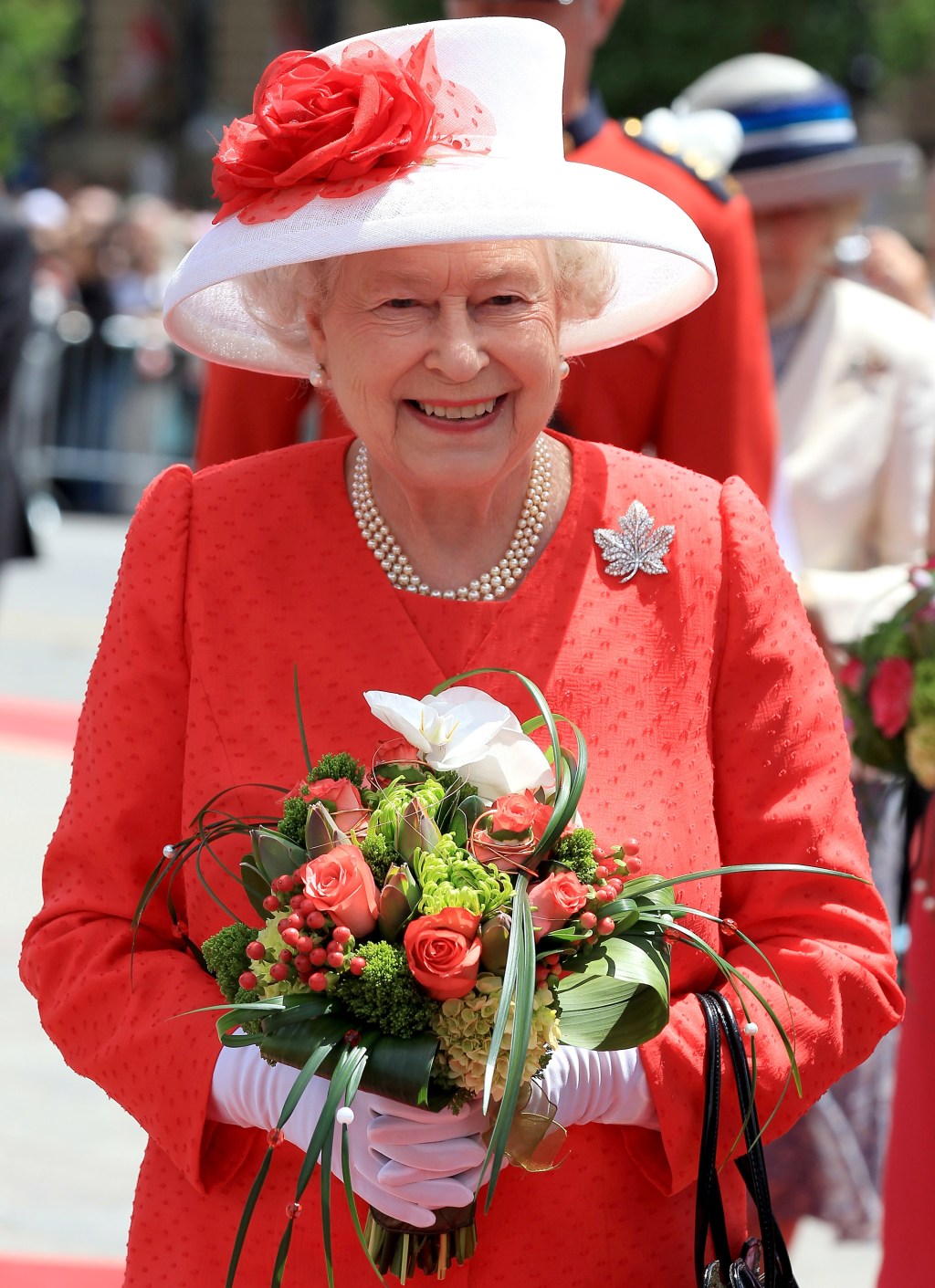 Queen Elizabeth’s diamond encrusted maple leaf brooch is seen as a strong show of support for Canada. Getty Images