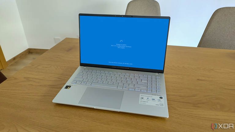 A laptop displaying a screen while Windows is rebooting to install updates