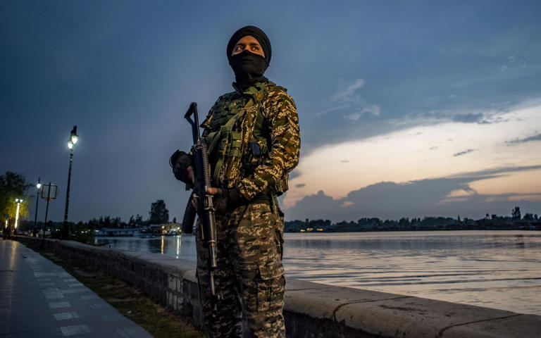 An Indian paramilitary soldier stands guard on the bank of Dal lake in Srinagar - Yawar Nazir/Getty Images