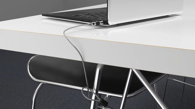 Illustration of a laptop anchored to a desk