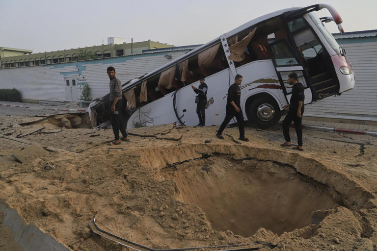 Palestinians inspect the site of an Israeli army airstrike on the European hospital in Khan Younis, Gaza Strip, Tuesday, May 13, 2025. The Israeli military said it had carried out a strike targeting what it said was a Hamas "command and control center" located beneath the hospital.