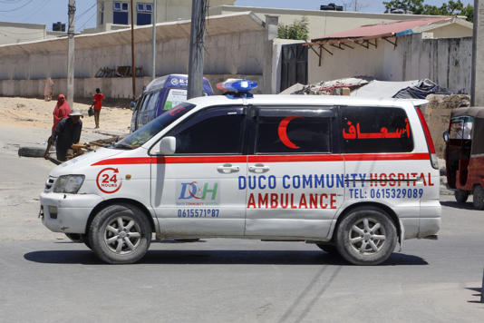 An ambulance is seen near the scene of a bomb attack in Mogadishu (Farah Abdi Warsameh/AP)