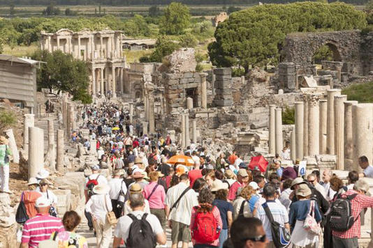 Tourists walking along Curetes Street